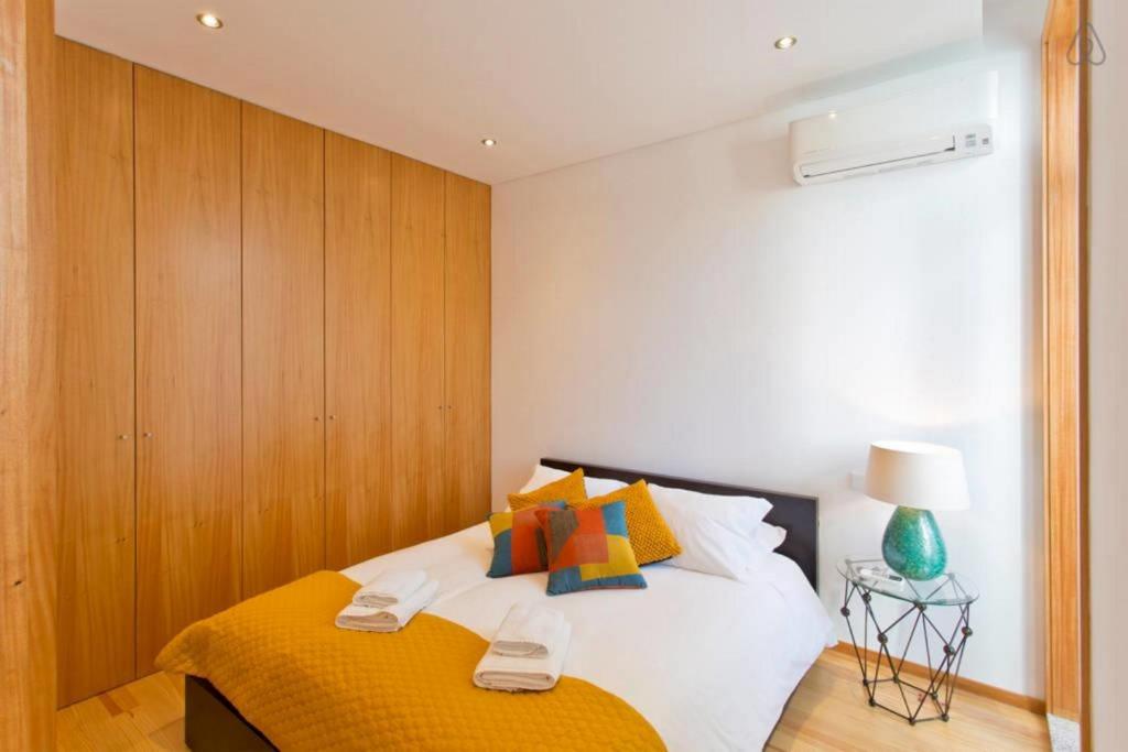 Postel nebo postele na pokoji v ubytování D'ALMA - Metro Loft
