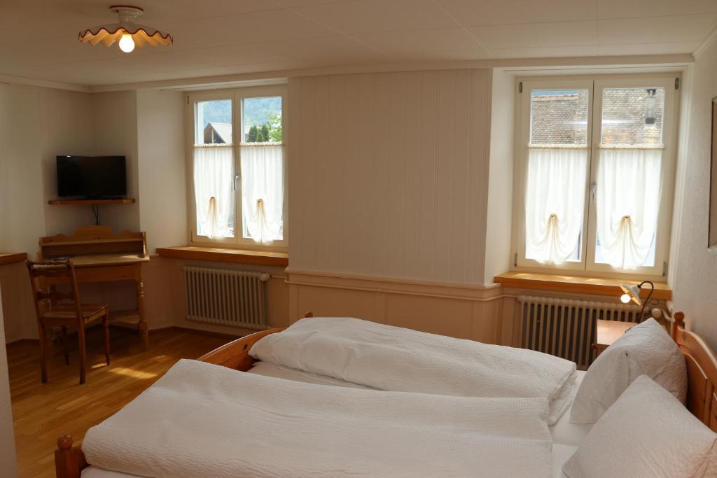 Postel nebo postele na pokoji v ubytování Hotel Lowen