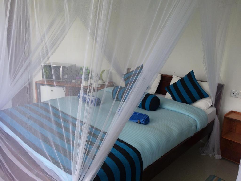 Postel nebo postele na pokoji v ubytování Sunray Homestay