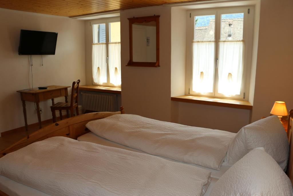 Postel nebo postele na pokoji v ubytování Hotel Lowen