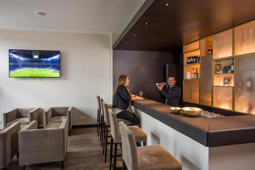 TV a/nebo společenská místnost v ubytování Hotel am Campus