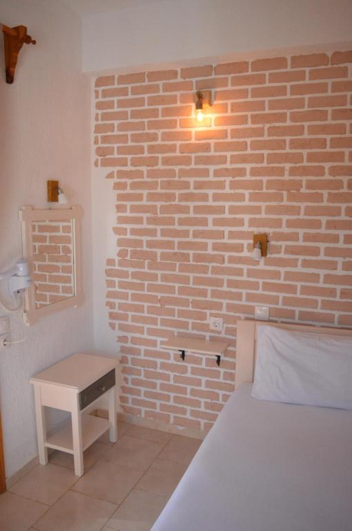 Postel nebo postele na pokoji v ubytování Anna George Studios