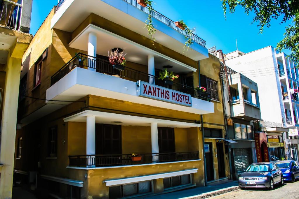 a building with a sign that reads knights music at Xanthis Hostel Nicosia City Centre in Nicosia