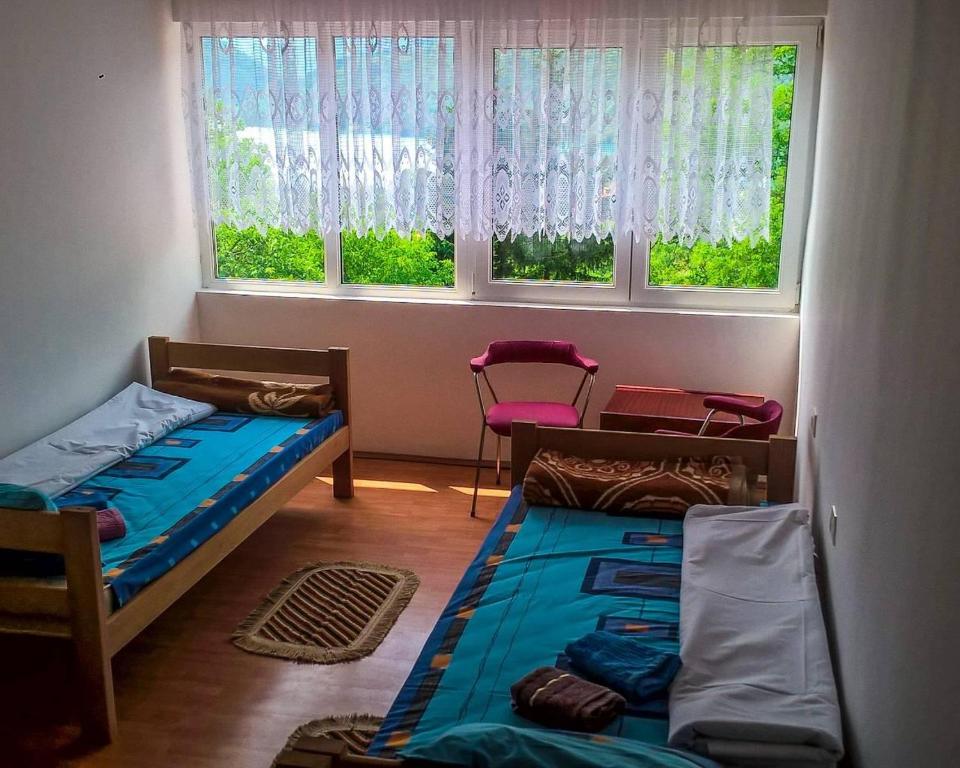 Postel nebo postele na pokoji v ubytování Guesthouse Mirkovic