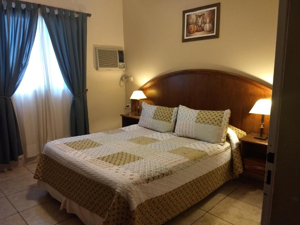 Ένα ή περισσότερα κρεβάτια σε δωμάτιο στο Hotel Suma Huasi