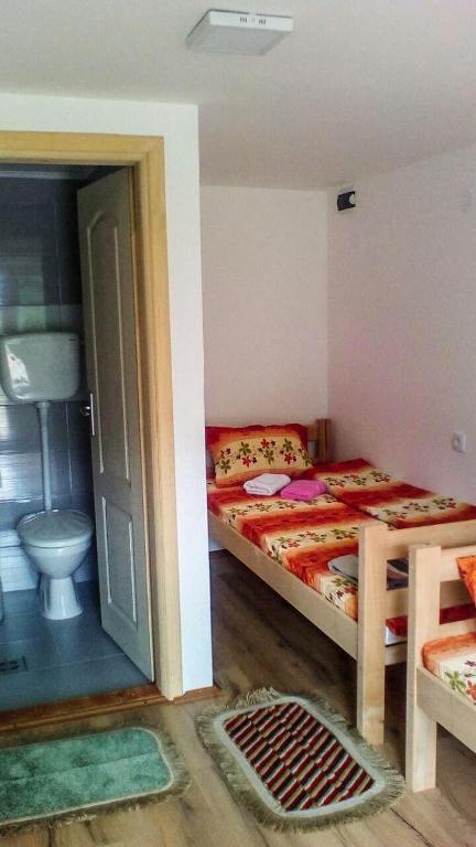 Postel nebo postele na pokoji v ubytování Guesthouse Mirkovic