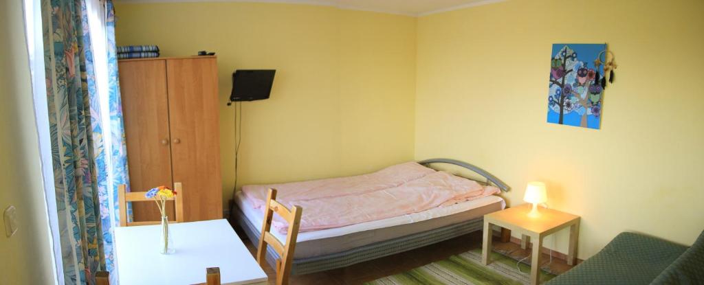 Postel nebo postele na pokoji v ubytování Pod Jesionem