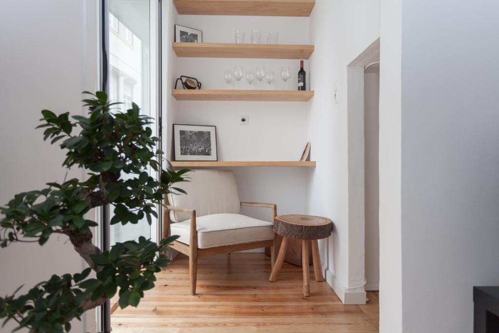 a living room with a chair and a table at BeGuest Santa Catarina Lisbon Apartment in Lisbon