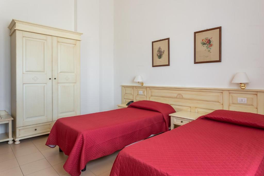 Postel nebo postele na pokoji v ubytování Rodia Inn