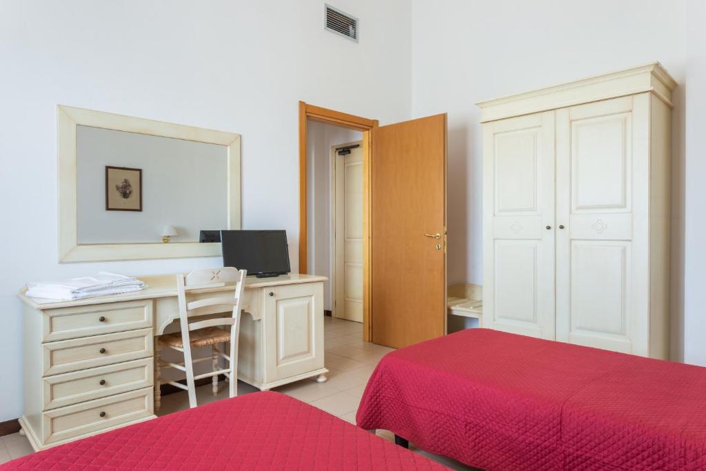 Postel nebo postele na pokoji v ubytování Rodia Inn