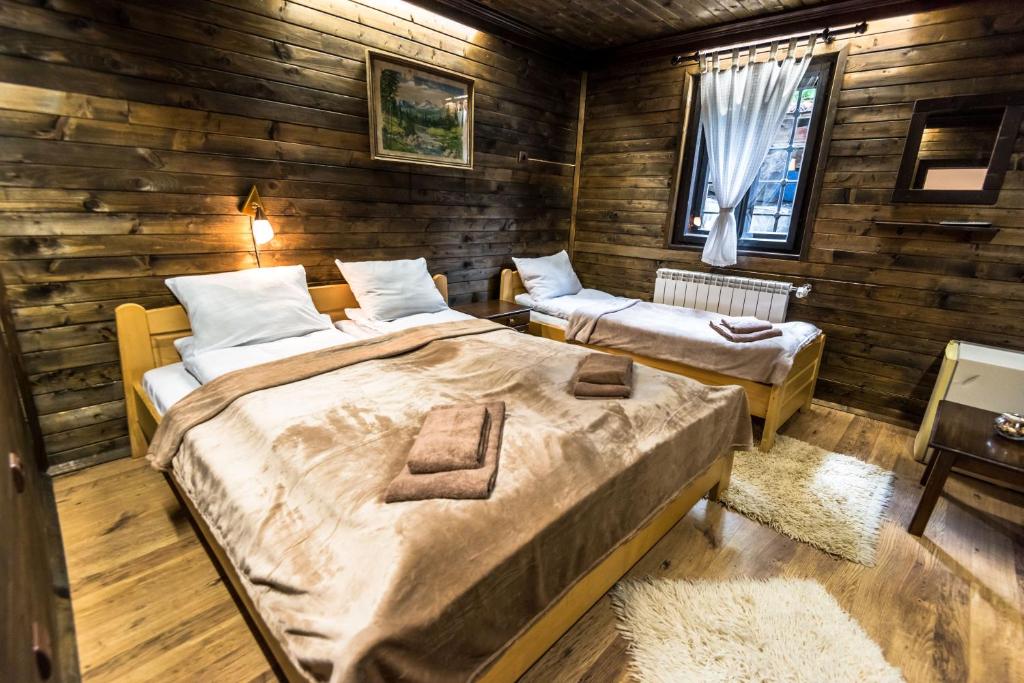 Postel nebo postele na pokoji v ubytování Banskovilla Zlateva House