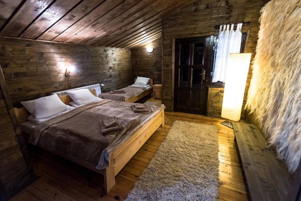 Postel nebo postele na pokoji v ubytování Banskovilla Zlateva House
