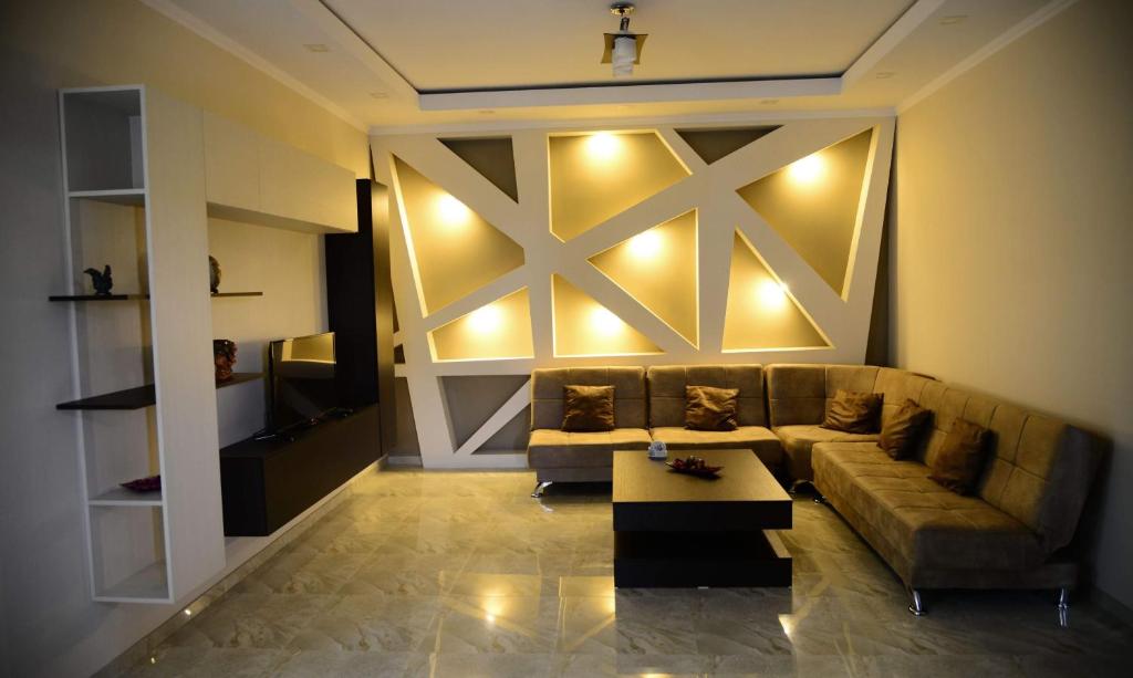 a living room with a couch and a coffee table at Metekhi Vista in Tbilisi City