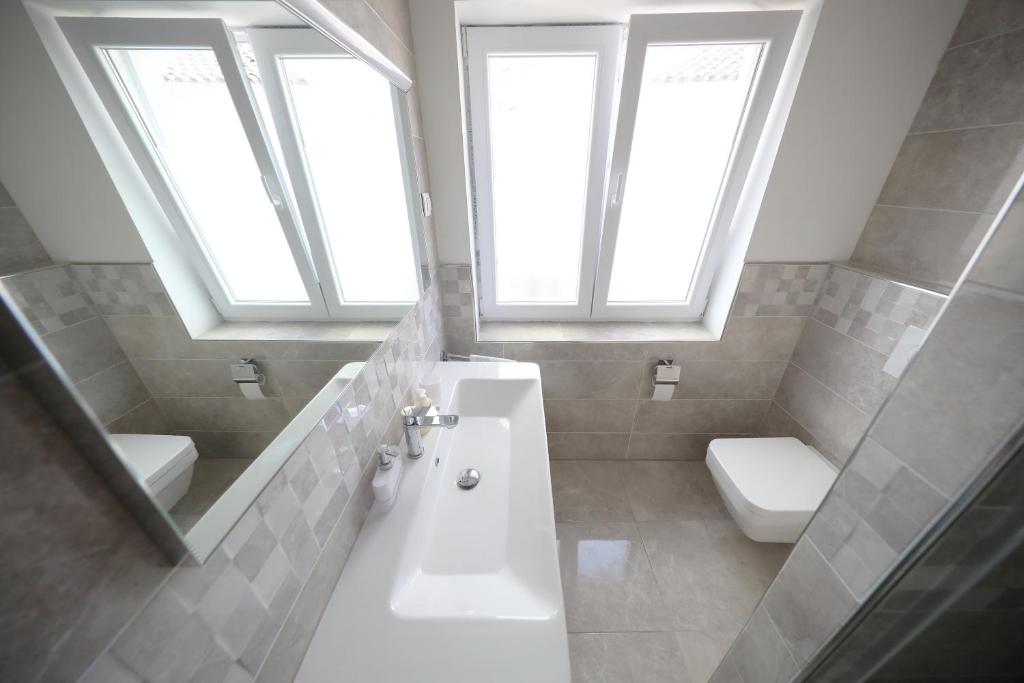 Kúpeľňa v ubytovaní Apartmani Postimana