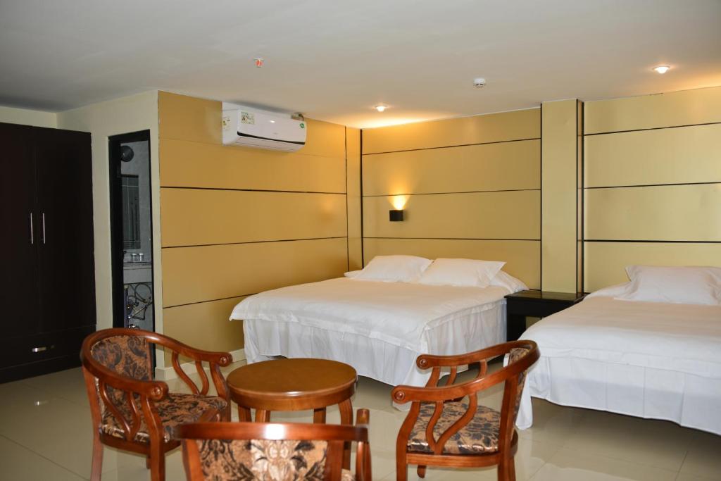 Voodi või voodid majutusasutuse Hotel F Sur Inn toas