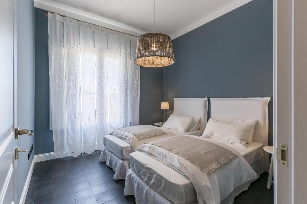 A bed or beds in a room at Villa Raphael