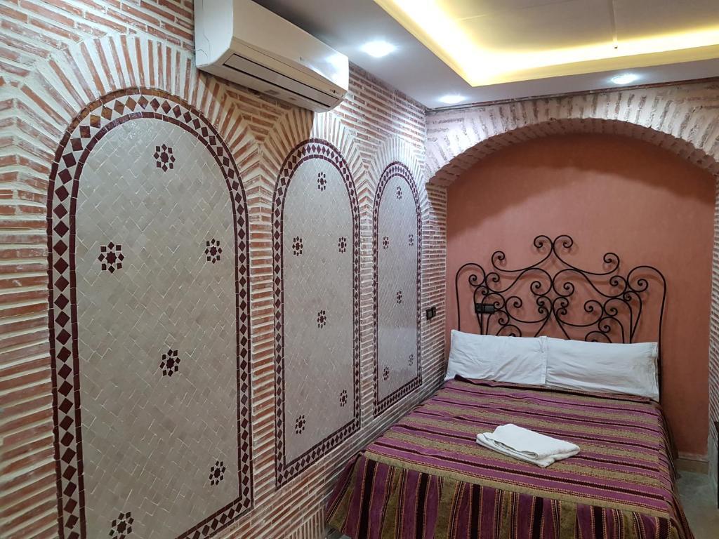 Postel nebo postele na pokoji v ubytování Hotel Salsabil