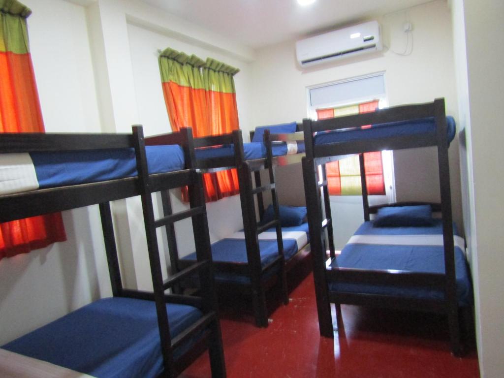 Postel nebo postele na pokoji v ubytování Kandy Backpackers Hostel