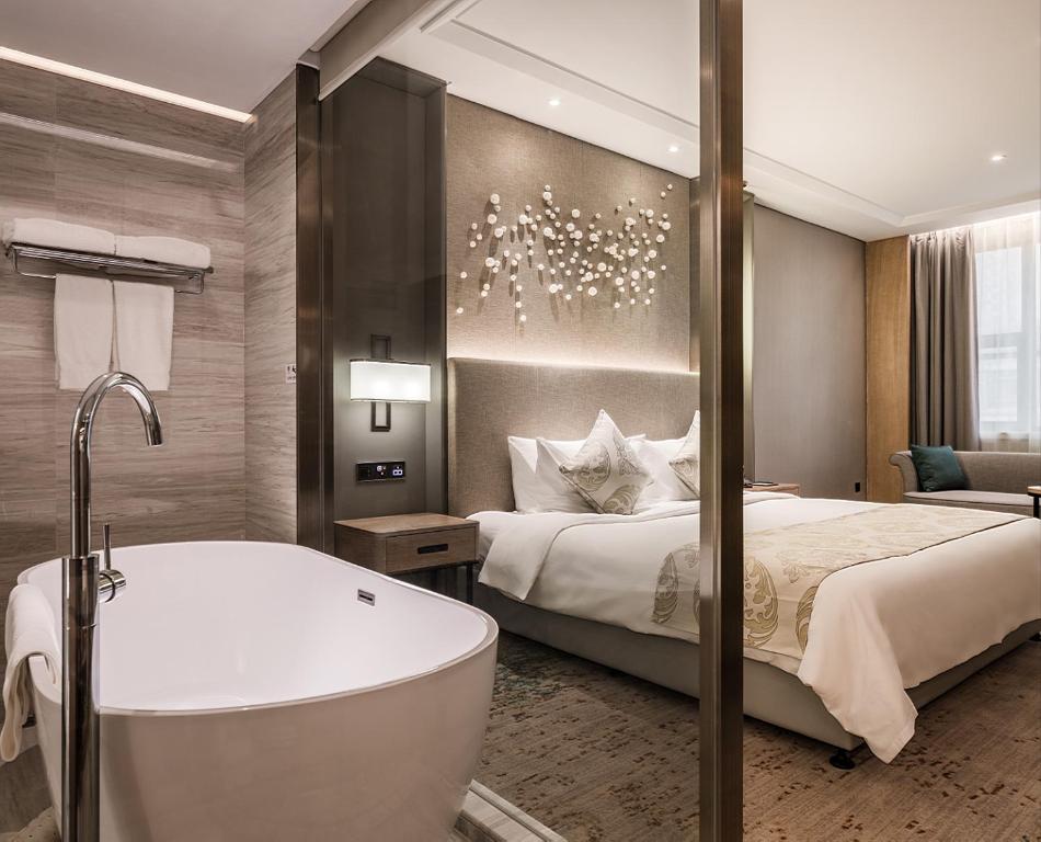 Voodi või voodid majutusasutuse Wuhan Hongguang Hotel toas