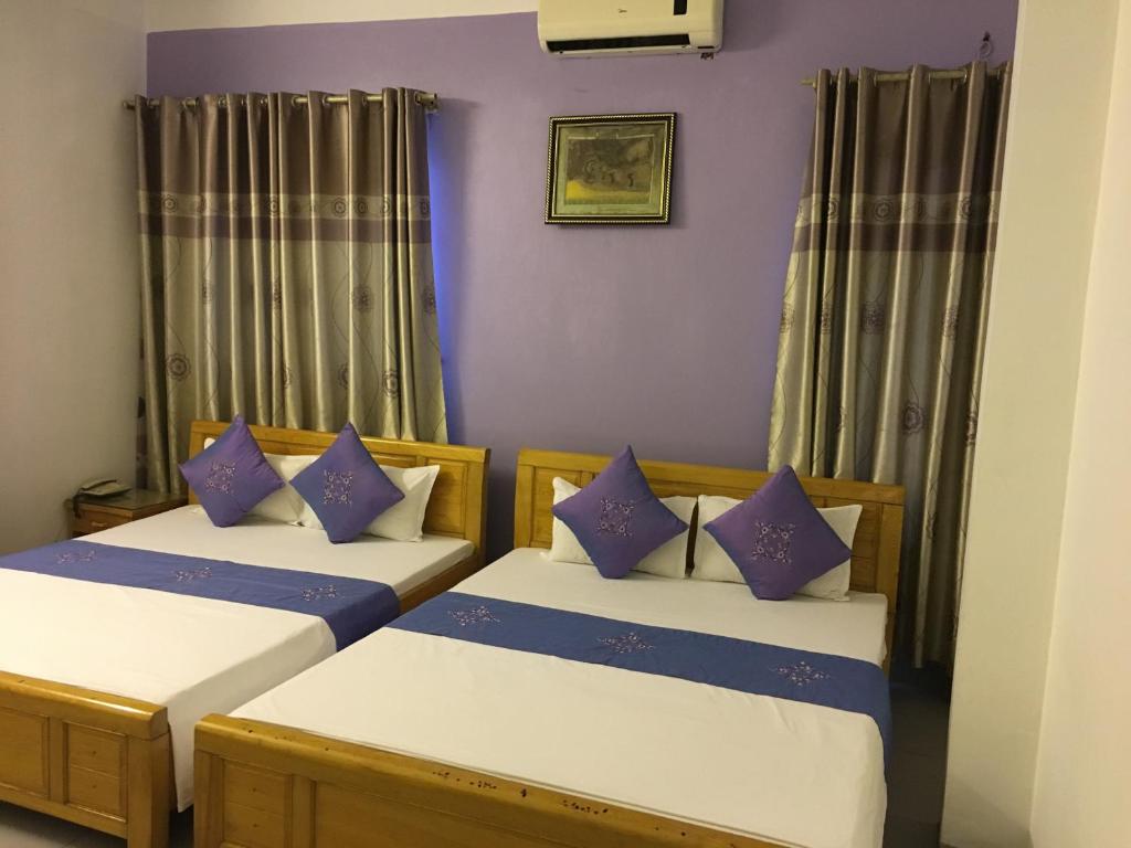 Postel nebo postele na pokoji v ubytování Hotel Hoang Gia