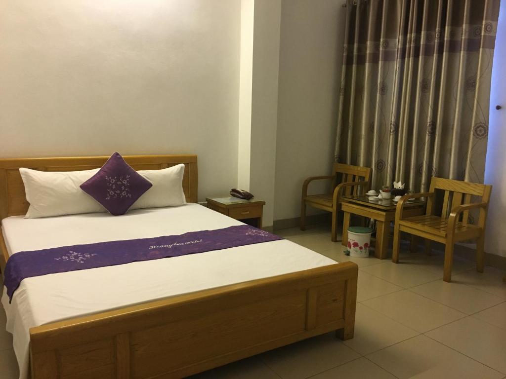 Postel nebo postele na pokoji v ubytování Hotel Hoang Gia