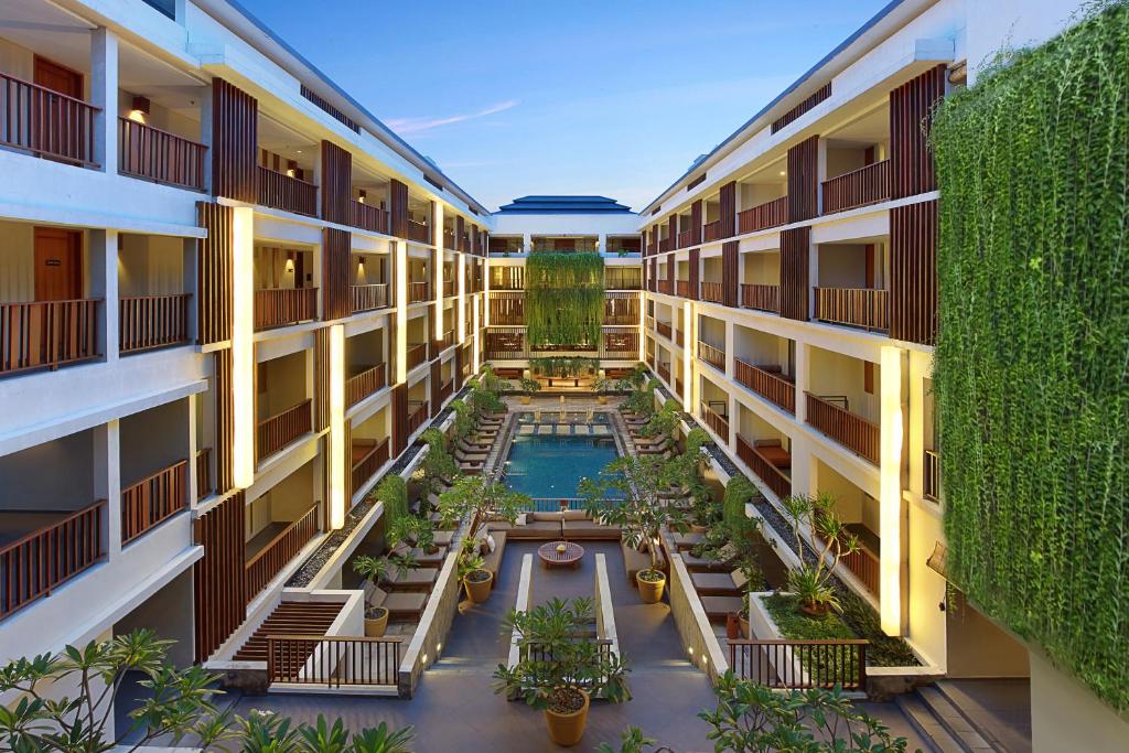 an overhead view of the courtyard of an apartment building at The Magani Hotel and Spa in Legian