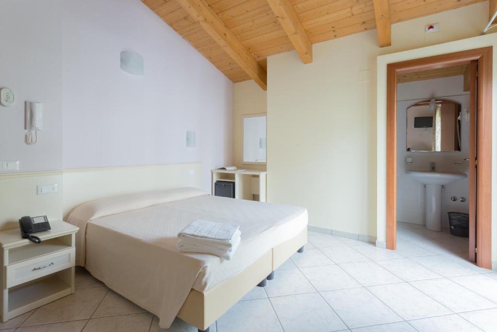 Postel nebo postele na pokoji v ubytování Hotel Cirillo Family Club - All Inclusive