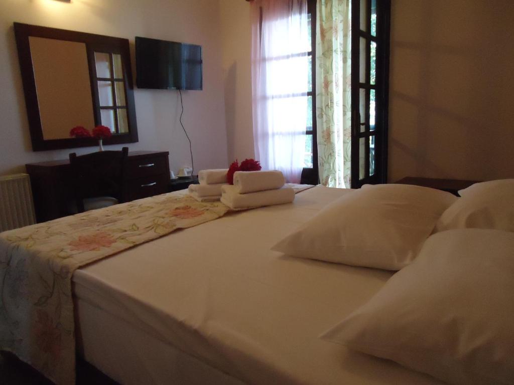Postel nebo postele na pokoji v ubytování Eden Hotel