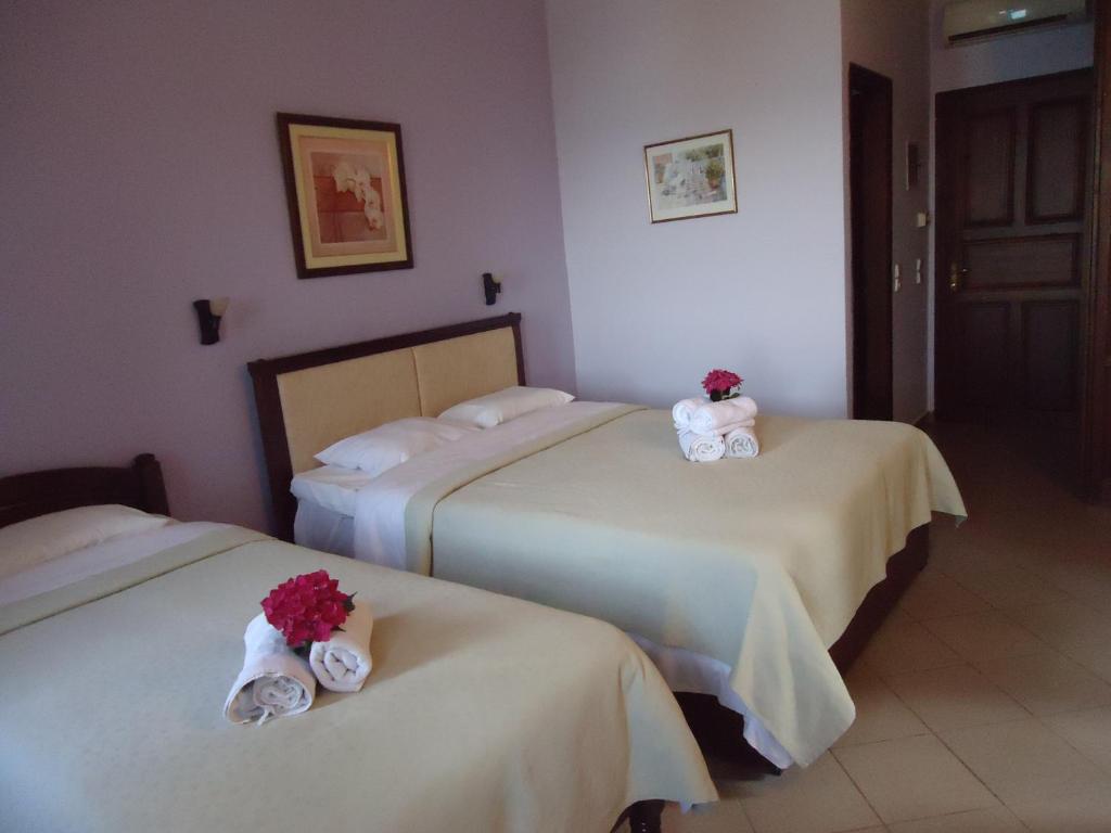 Postel nebo postele na pokoji v ubytování Eden Hotel