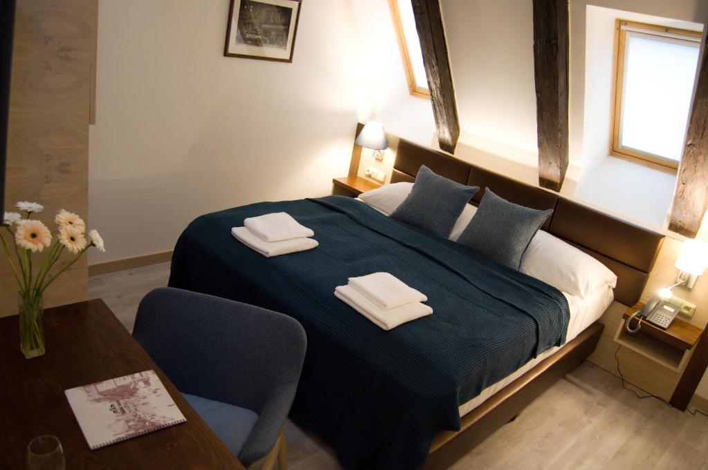 Postel nebo postele na pokoji v ubytování U Medvidku-Brewery Hotel
