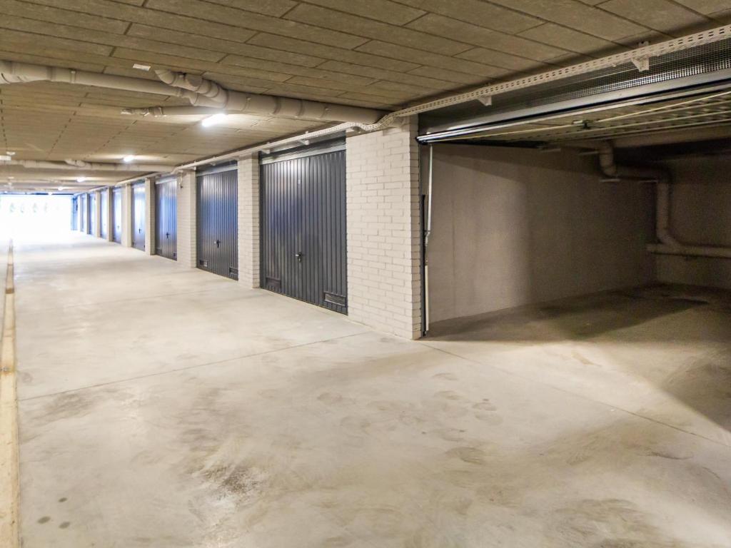 an empty parking lot in a parking garage at Apartamenty Baltia Kołobrzeg - Bliżej Morza in Kołobrzeg