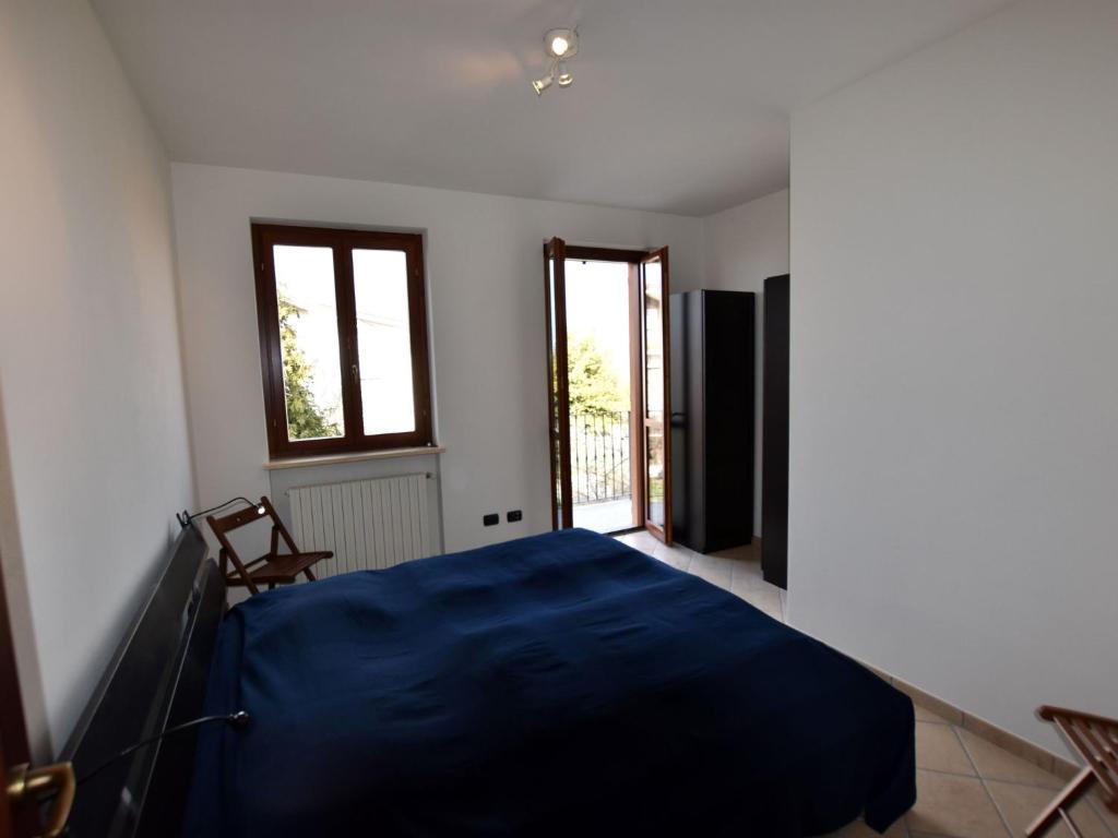 Postel nebo postele na pokoji v ubytování Apartment in Belvedere Langhe with Wine Views