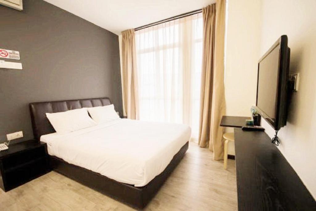 TV a/nebo společenská místnost v ubytování Sandy Hotel Malacca