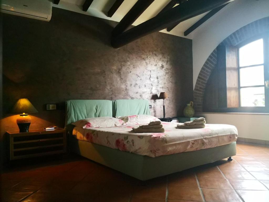 Postel nebo postele na pokoji v ubytování B&B Il Martin Pescatore