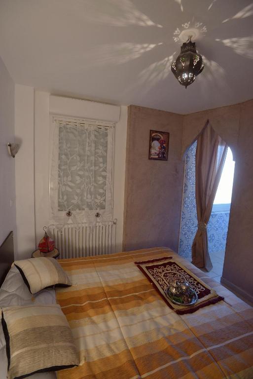 Postel nebo postele na pokoji v ubytování L'Acilya