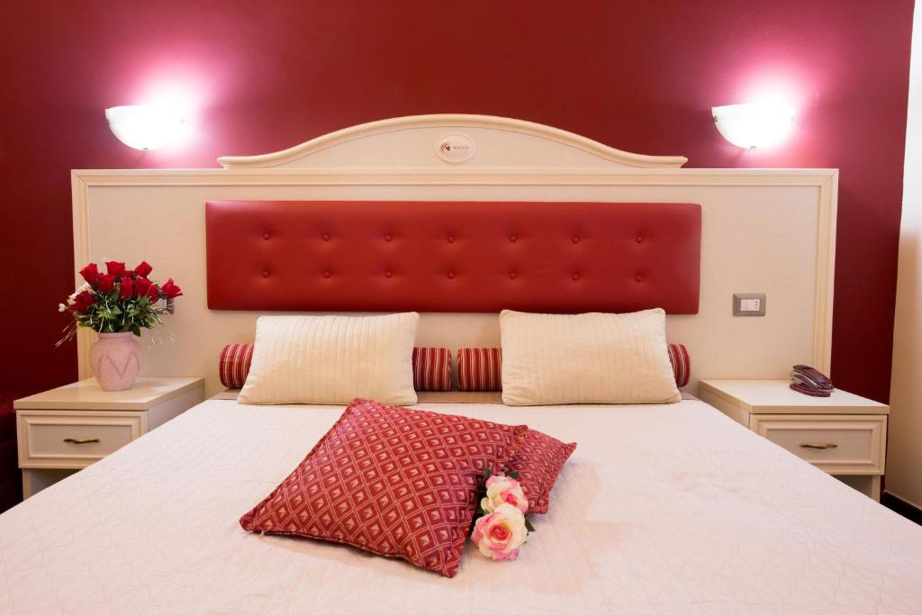 Postel nebo postele na pokoji v ubytování Relais Parallelo 41