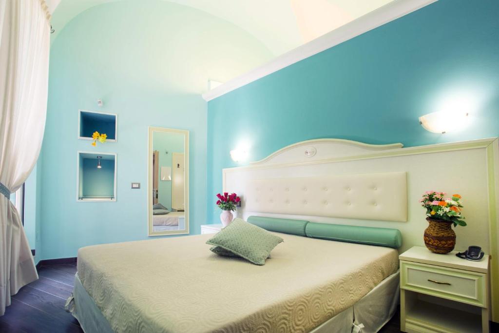 Postel nebo postele na pokoji v ubytování Relais Parallelo 41