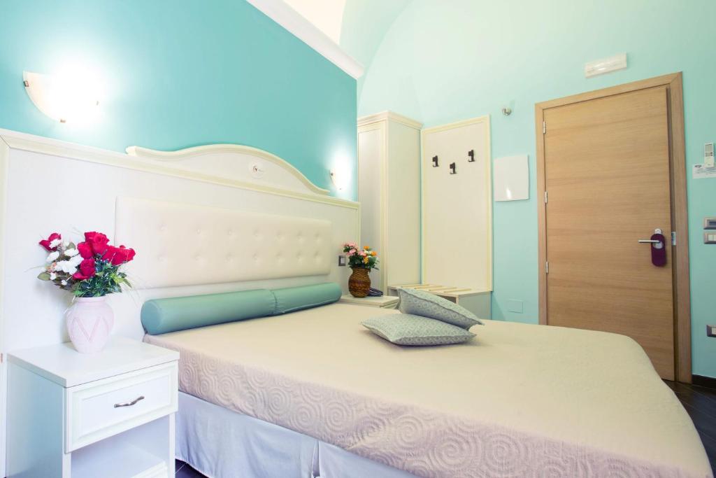 Postel nebo postele na pokoji v ubytování Relais Parallelo 41