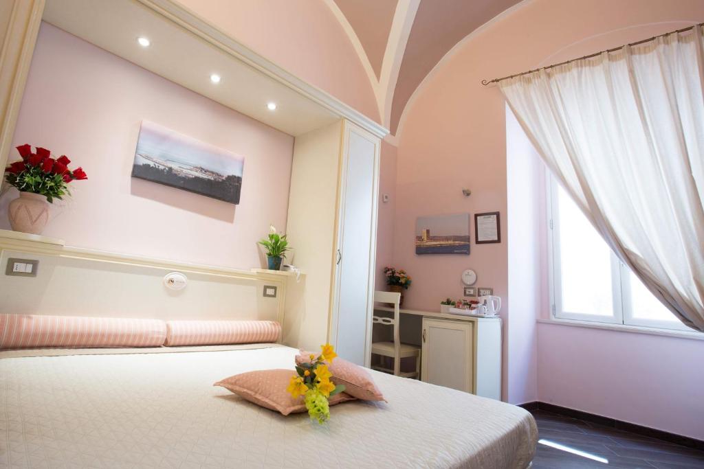 Postel nebo postele na pokoji v ubytování Relais Parallelo 41