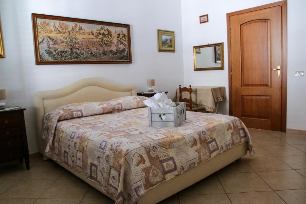 Postel nebo postele na pokoji v ubytování B&B Maria Piddu