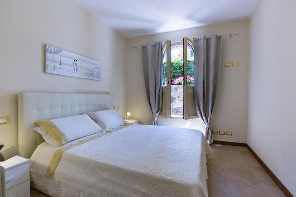 Postel nebo postele na pokoji v ubytování Villa Gobbi Benelli