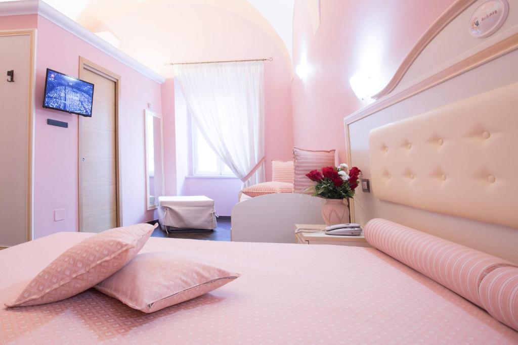 Postel nebo postele na pokoji v ubytování Relais Parallelo 41
