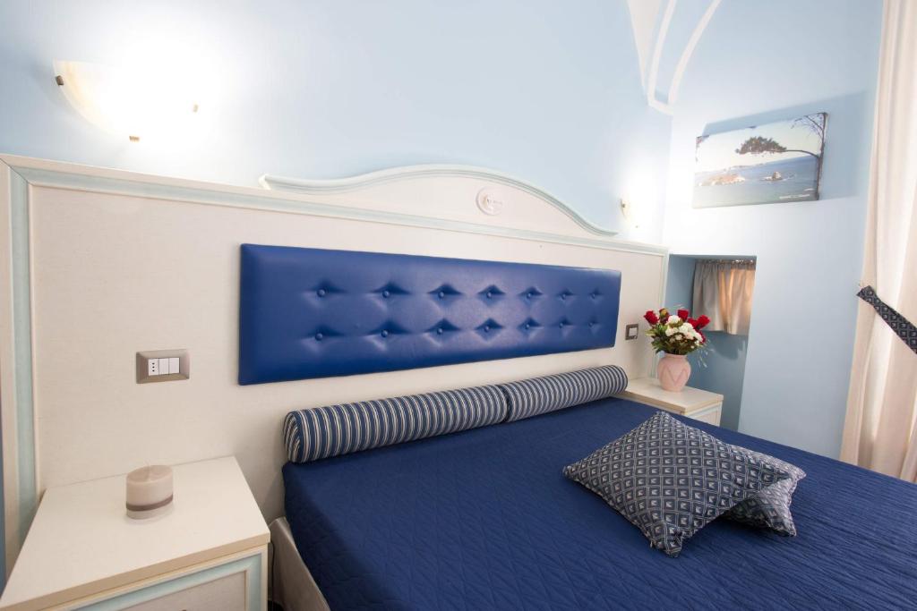 Un pat sau paturi într-o cameră la Relais Parallelo 41