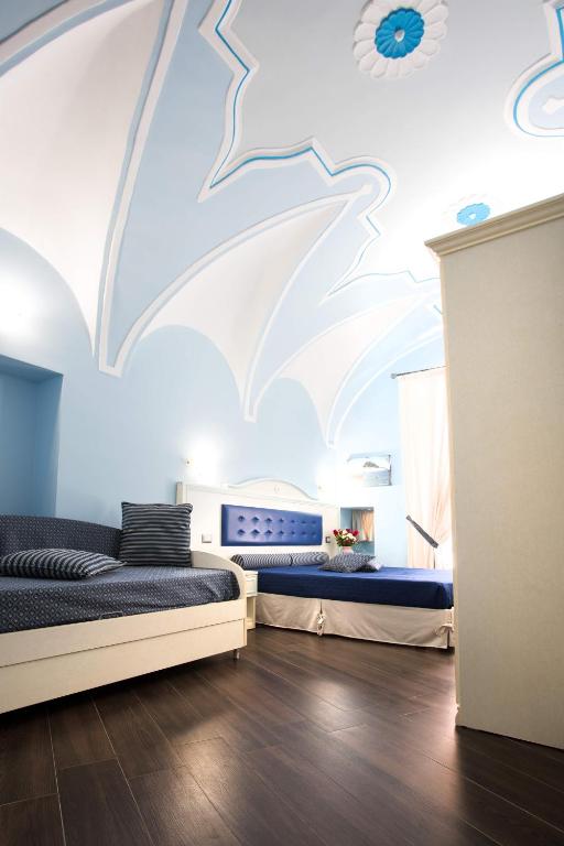 Postel nebo postele na pokoji v ubytování Relais Parallelo 41