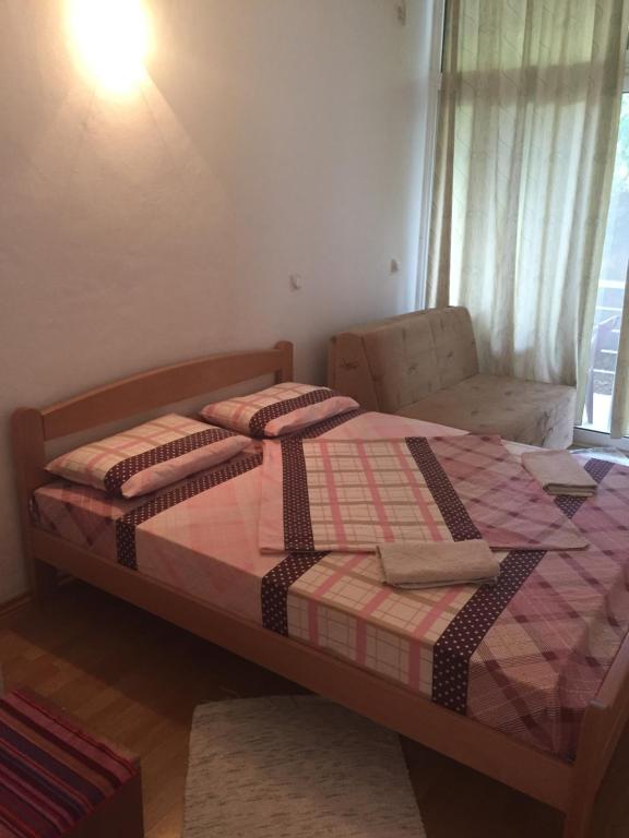 Postel nebo postele na pokoji v ubytování Tina Rooms