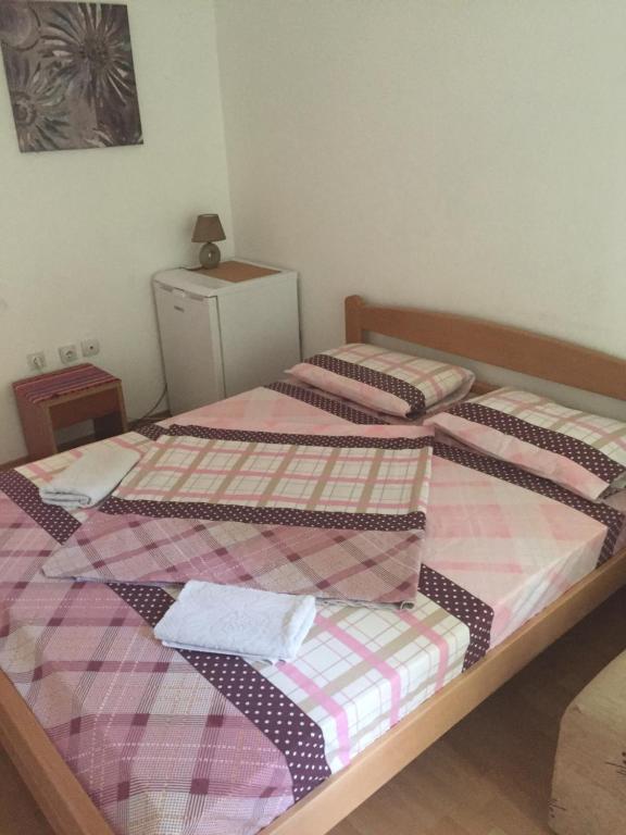Postel nebo postele na pokoji v ubytování Tina Rooms
