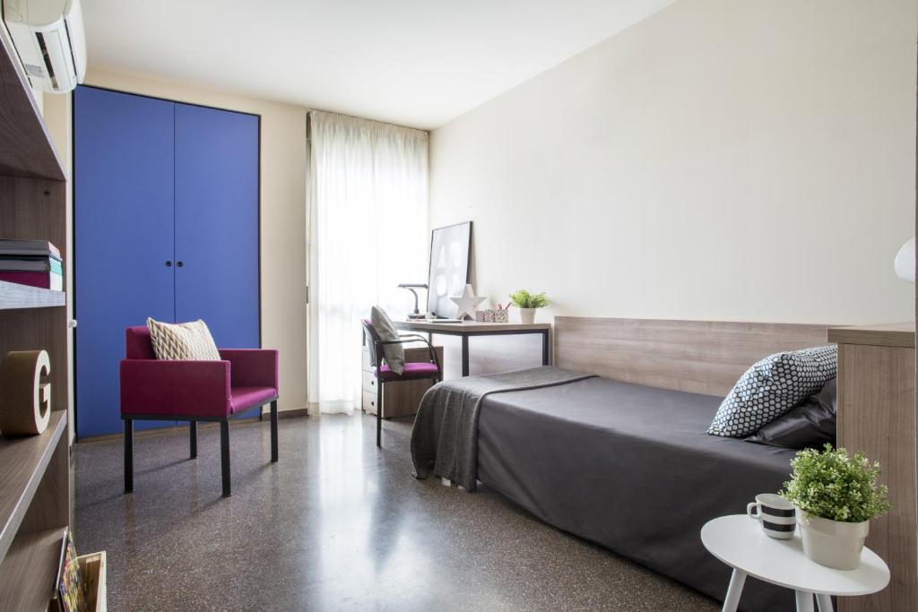 Postel nebo postele na pokoji v ubytování Residencia Universitaria Resa Hernan Cortes