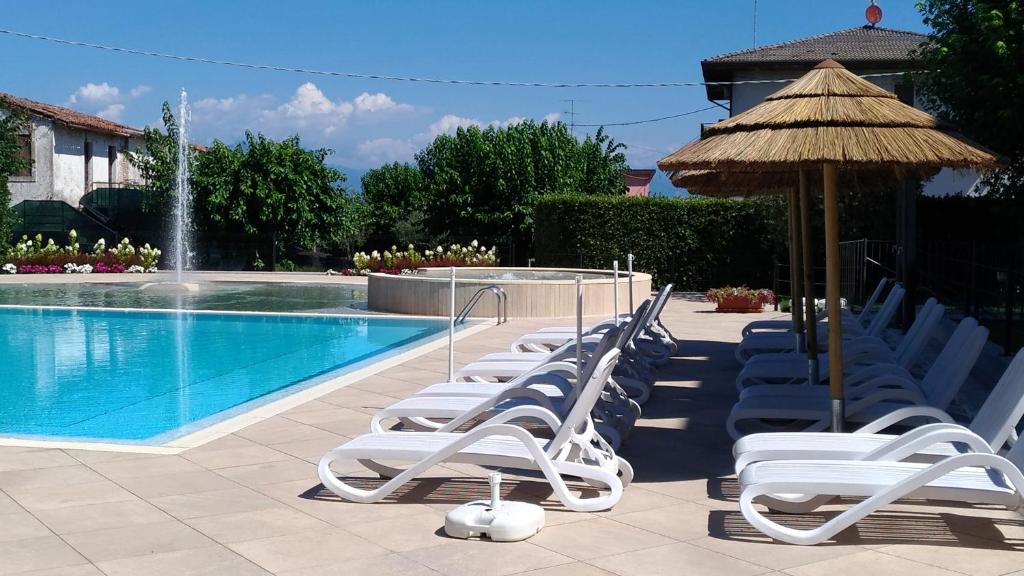 Het zwembad bij of vlak bij Nettuno Residence Hotel