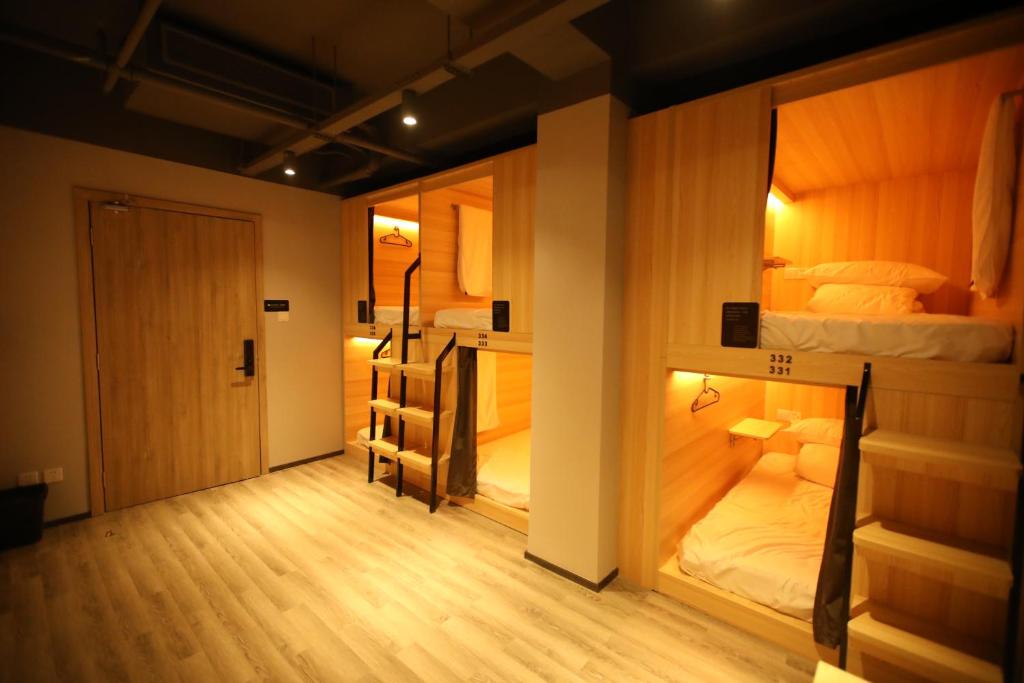 Postel nebo postele na pokoji v ubytování Chengdu Desti Youth Park Hostel Chunxi Road