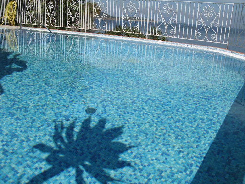 a pool of water with a blue sky at Hotel Don Felipe in Ischia